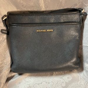 Michael Kors Black bag w/adjustable strap and gold accents